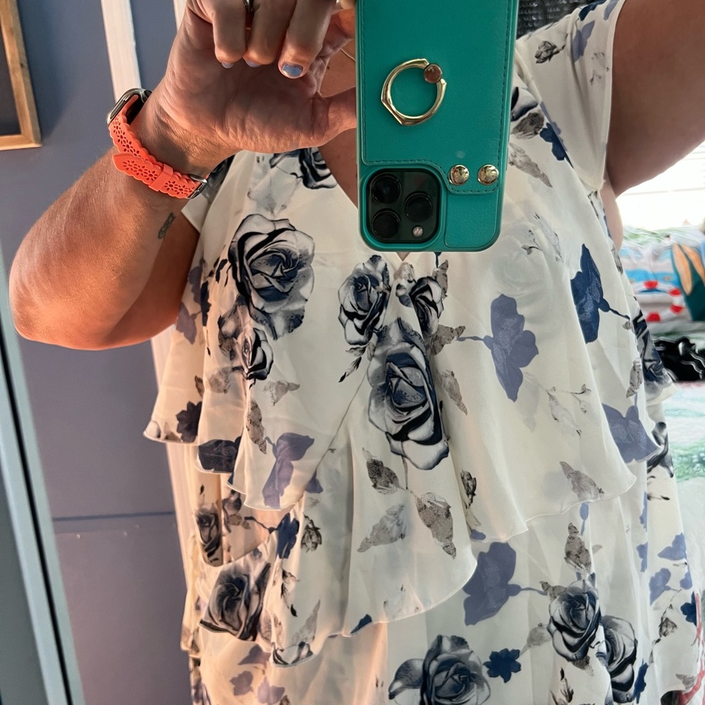 Size 26 blue and cream floral top. New